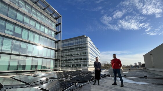 Technical Director Jennifer Taillefer and Facilities Manager Gaetano Borgia stand on the Unicorn roof with our new panels.