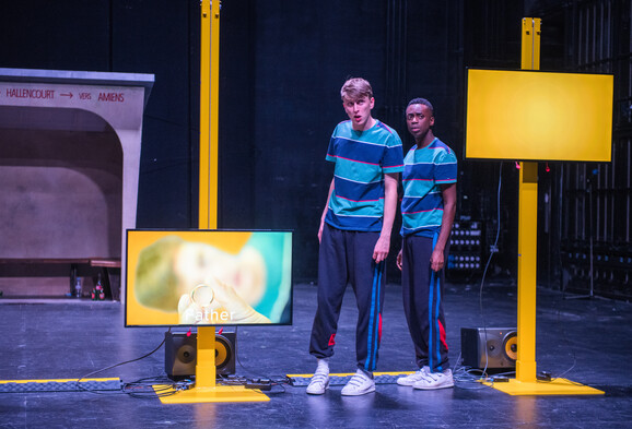 Two young men in striped t-shirts in a show